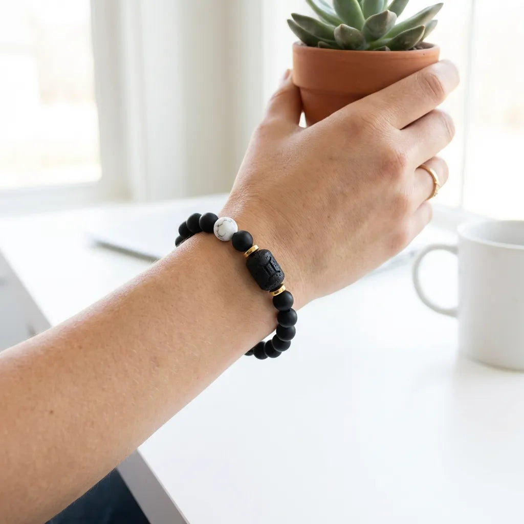 Gemini Zodiac Bracelet worn on wrist with black beads and white stone, trendy astrology jewelry for everyday confidence and style
