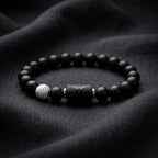 Gemini Zodiac Bracelet on dark fabric with matte beads and symbol charm, modern astrology jewelry for sleek and confident everyday wear