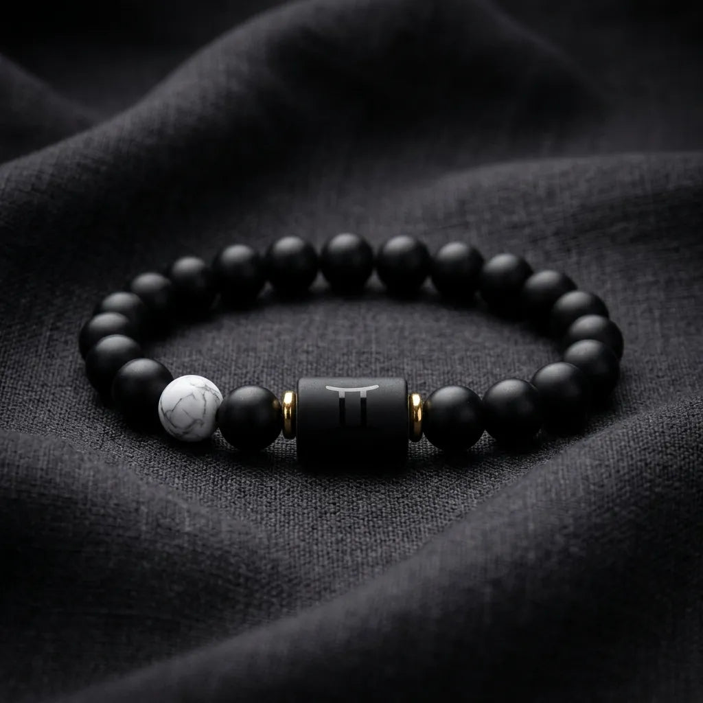 Gemini Zodiac Bracelet on dark fabric with matte beads and symbol charm, modern astrology jewelry for sleek and confident everyday wear