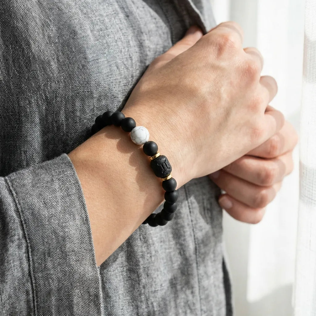 Gemini Zodiac Bracelet worn casually with black beads and white marble accent, stylish astrology jewelry for relaxed everyday outfits