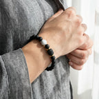 Gemini Zodiac Bracelet worn casually with black beads and white marble accent, stylish astrology jewelry for relaxed everyday outfits