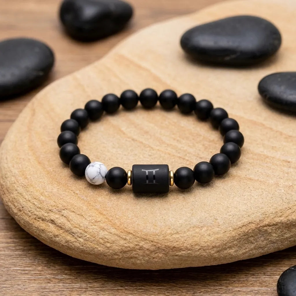 Gemini Zodiac Bracelet on stone surface with black beads and marble accent, calming astrology jewelry for balance energy and mindful style