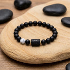 Gemini Zodiac Bracelet on stone surface with black beads and marble accent, calming astrology jewelry for balance energy and mindful style