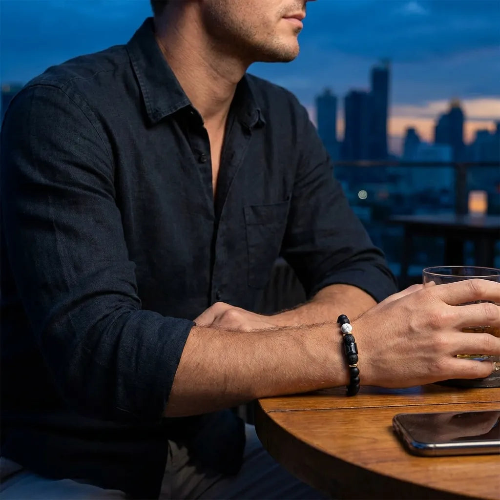 Gemini Zodiac Bracelet worn by man at evening setting, black bead astrology jewelry for masculine style and confident everyday wear