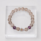 Amethyst crystal bracelet with polished gemstone beads and decorative heart charm for modern elegance