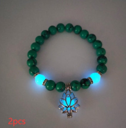 Glow in the dark lotus bracelet two-piece green stone set with a blue glow, with 8 mm real-stone beads, elastic fit, a silver-color lotus, and light-charged accents for a dim view.