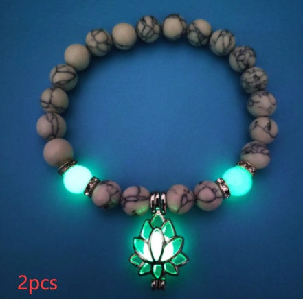 Glow in the dark lotus bracelet two-piece pale marbled set with green glow, with 8 mm real-stone beads, elastic fit, a silver-color lotus, and light-charged accents for a dim view.