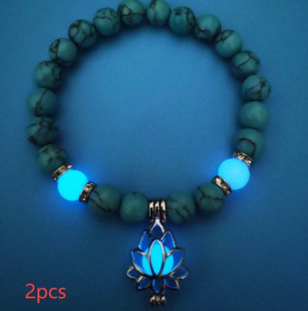 Glow in the dark lotus bracelet two-piece blue-green set with a blue glow, with 8 mm real-stone beads, elastic fit, a silver-color lotus, and light-charged accents for daily style.