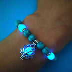 Glow in the dark lotus bracelet blue-green bracelet worn on the wrist, with 8 mm real-stone beads, elastic fit, a silver-color lotus, and light-charged accents for glow after dark.