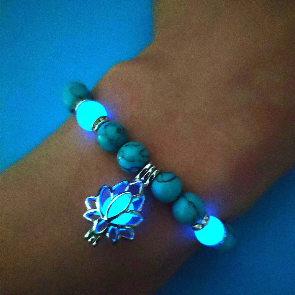 Glow in the dark lotus bracelet blue-green bracelet worn on the wrist, with 8 mm real-stone beads, elastic fit, a silver-color lotus, and light-charged accents for glow after dark.