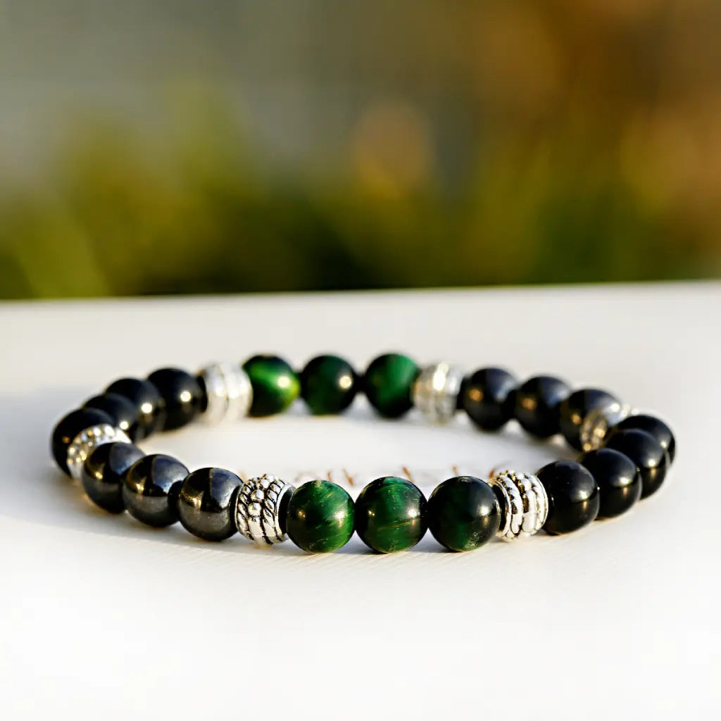 Green tigereye bracelet with polished green gemstone beads and black hematite stones for elegant energy style