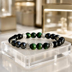 Green tigereye bracelet with natural gemstone beads and black stone accents for elegant energy jewelry