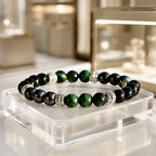 Green tigereye bracelet with polished gemstone beads and silver accents creating elegant energy jewelry style
