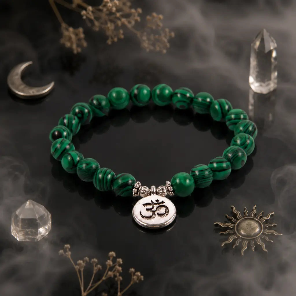 Green tigereye bracelet with striped gemstone beads and silver Om charm in mystical crystal-inspired setting