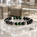 Green tigereye bracelet with glossy gemstone beads displayed elegantly for healing crystal jewelry use
