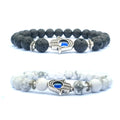 Hamsa evil eye bracelet shown in black and white natural-stone bead options, with silver-tone alloy spacers and blue-eye hand accents on clean, bright white product background set.