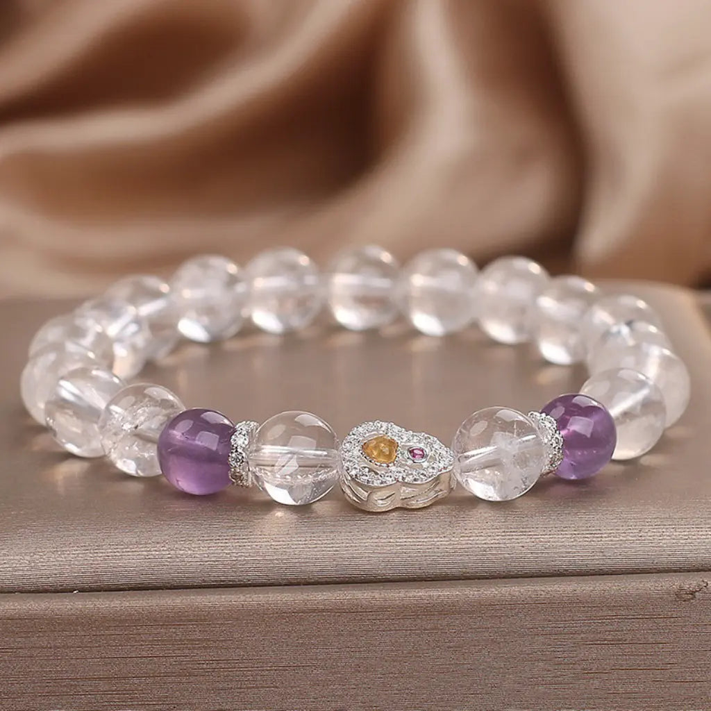 Healing crystal bracelet with purple gemstone accents and sparkling beads for calming daily energy support