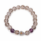 Gemstone bracelet featuring clear crystal beads and purple accents for elegant spiritual accessory styling
