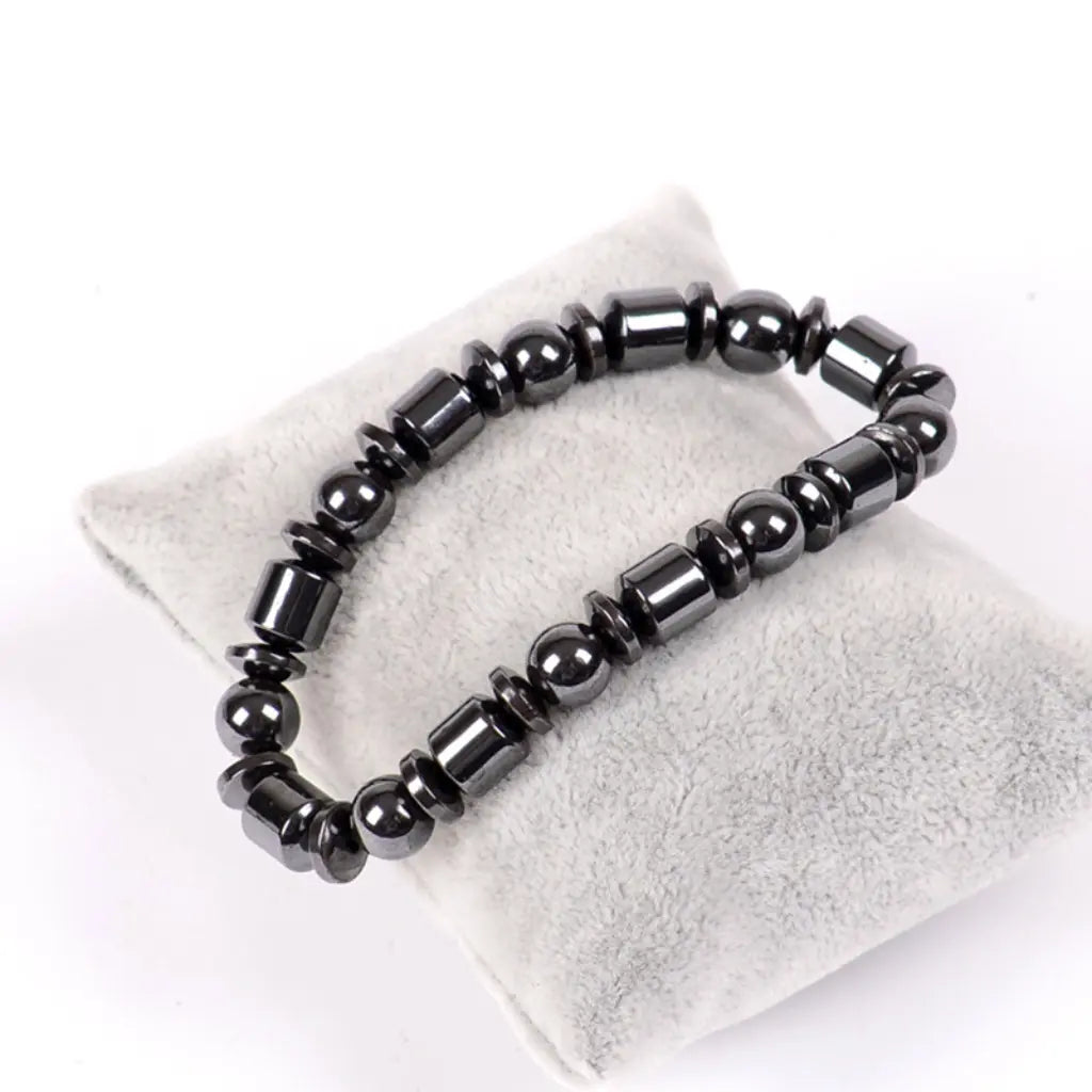 Hematite bracelet displayed with glossy black gemstone beads, grounding energy jewelry for modern style appeal