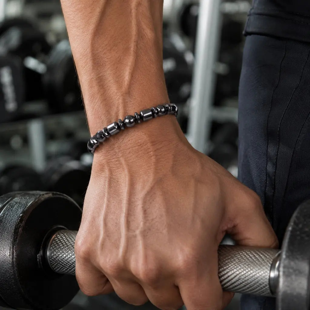 Hematite bracelet during gym training adding sleek black gemstone style and active lifestyle confidence
