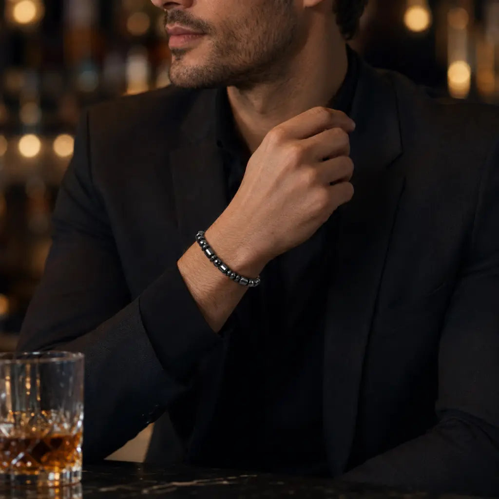 Hematite bracelet worn with formal menswear adding modern gemstone style and sophisticated confidence