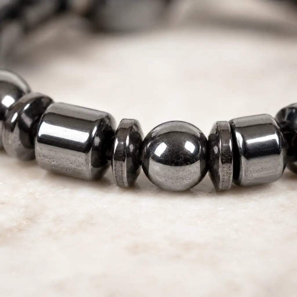 Hematite bracelet macro view with polished black stone beads, healing energy accessory for elegant style