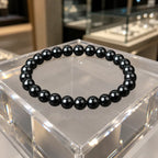 Hematite bracelet crafted with smooth black gemstone beads and healing crystal details for modern fashion use