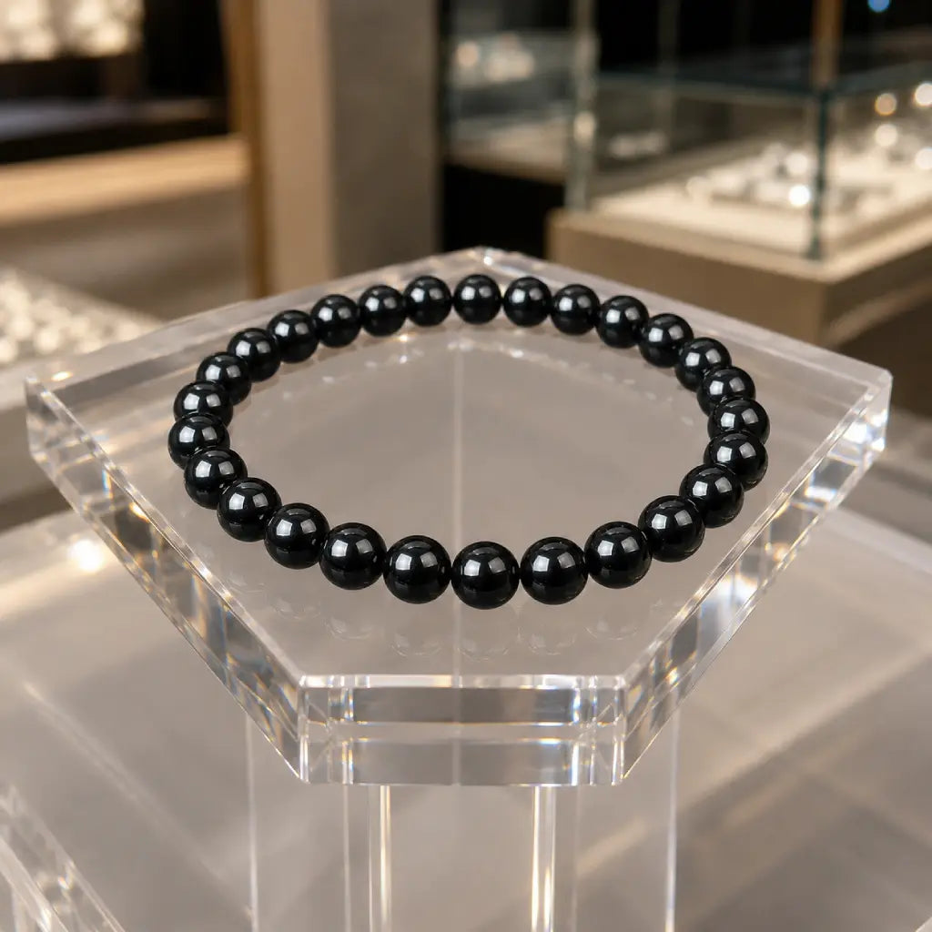 Hematite bracelet featuring glossy black round beads with natural stone energy jewelry for stylish everyday wear