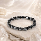 Hematite bracelet with dark polished beads in spiritual setting, healing crystal jewelry for calming energy