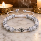 Howlite bracelet with natural white veined beads styled beside candles for soothing spiritual wellness vibes
