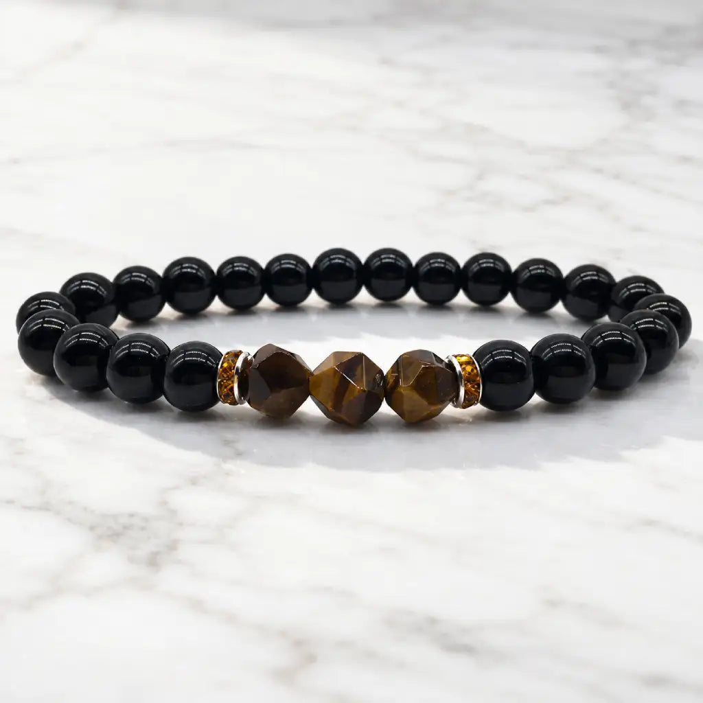 Labradorite and tiger eye bracelet on white marble with polished gemstone beads for sleek modern energy