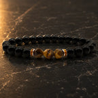 Labradorite and tiger eye bracelet on black marble with polished beads for premium crystal jewelry appeal