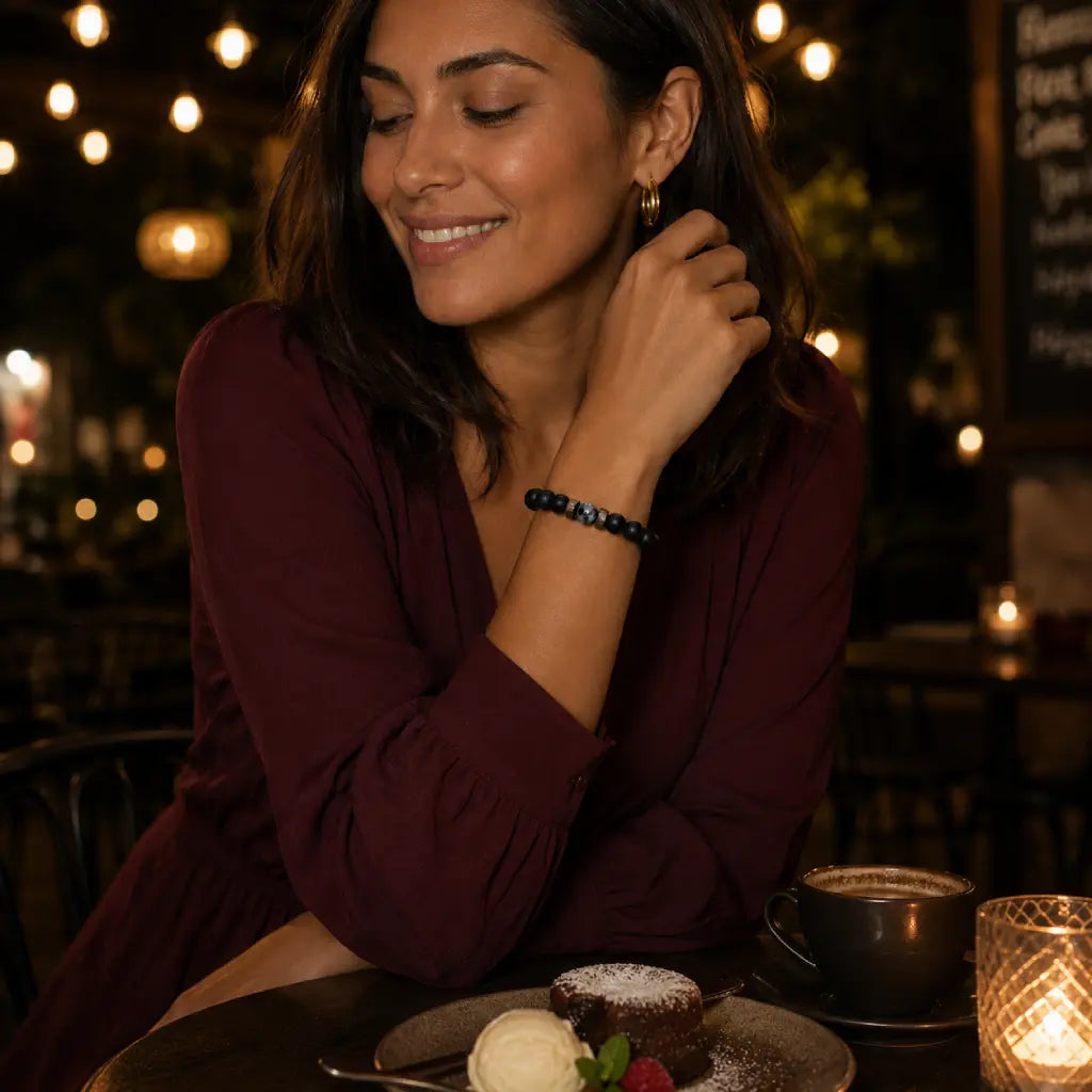 Labradorite bracelet with natural gemstone and matte black beads styled for cozy café fashion and relaxed everyday elegance.