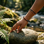 Labradorite crystal bracelet worn beside forest stream promoting grounding balance and mindful outdoor wellness
