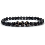 Labradorite dzi bracelet product photo with matte black beads and polished Dzi stones on clean white background