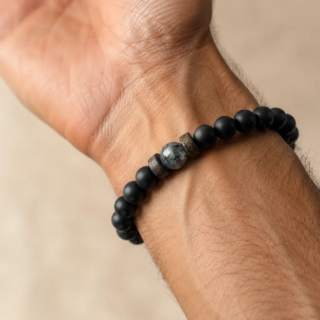 Labradorite natural stone bracelet with matte black beads and authentic gemstone centerpiece designed for minimalist men's jewelry.