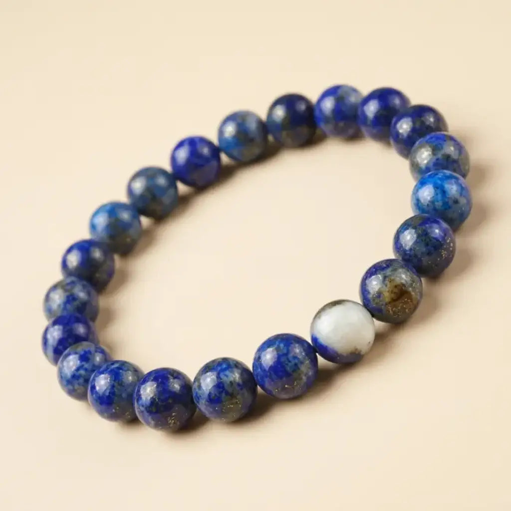 Lapis lazuli bracelet in angled closeup, premium blue gemstone bead jewelry with artisan detail and calm energy