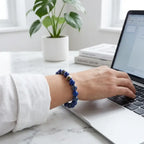 Lapis lazuli bracelet at a laptop desk, modern gemstone bead jewelry for calm focus and polished office style