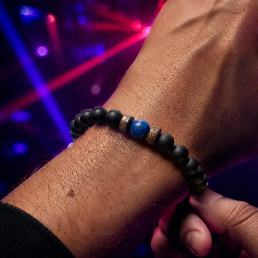 Lapis Lazuli onyx bracelet with matte black onyx beads and vibrant blue lapis lazuli centerpiece, styled for a modern evening look.