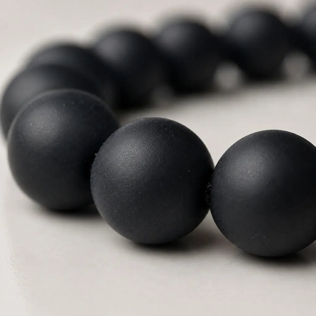 Lapis Lazuli onyx bracelet close-up highlighting smooth matte black onyx beads with premium craftsmanship and minimalist design.