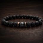 Lava labradorite bracelet presented on wood surface with natural lava stone beads and elegant gemstone center
