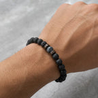 Lava labradorite bracelet worn on wrist showing volcanic stone beads and gemstone centerpiece for everyday fashion