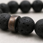 Lava labradorite bracelet close up featuring textured volcanic stone beads and artisan spacer accents