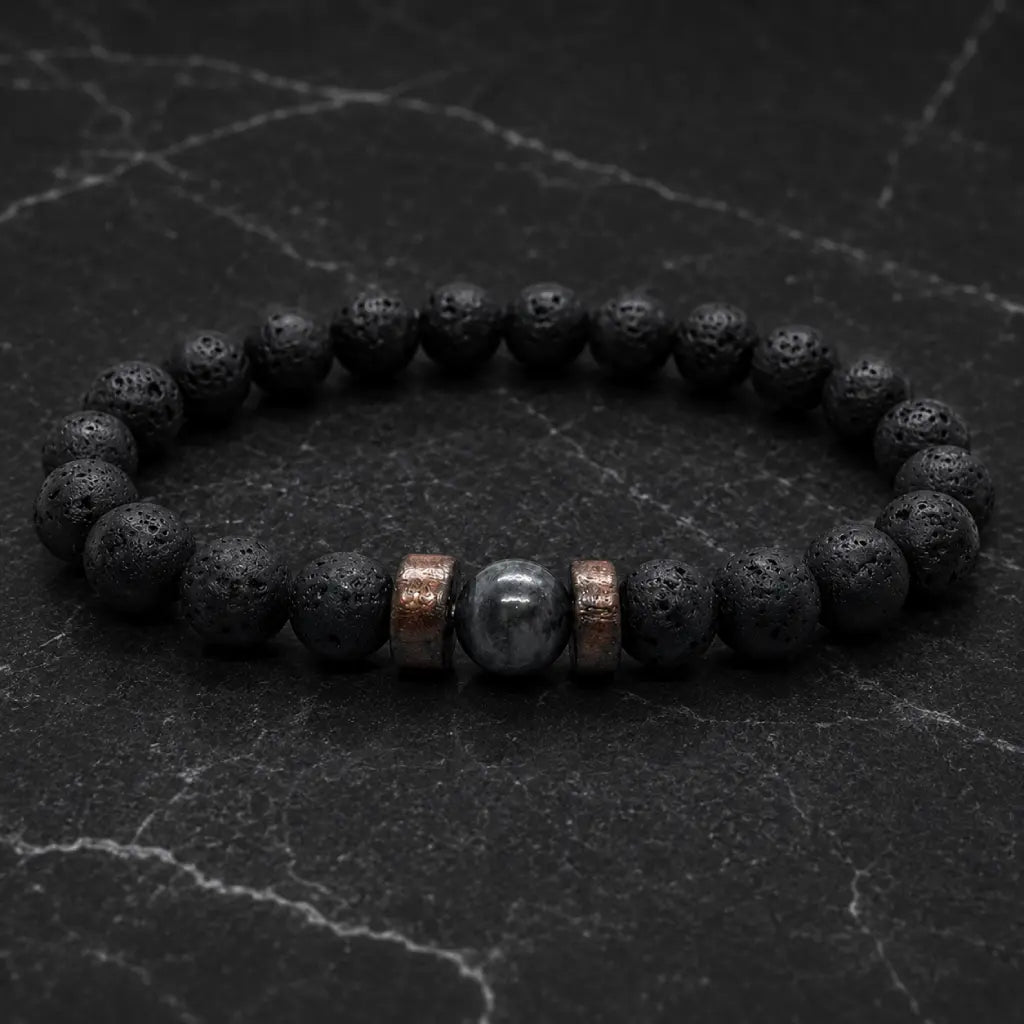 Lava labradorite bracelet photographed on stone surface highlighting porous lava beads and premium gemstone