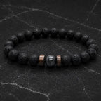 Lava labradorite bracelet photographed on stone surface highlighting porous lava beads and premium gemstone