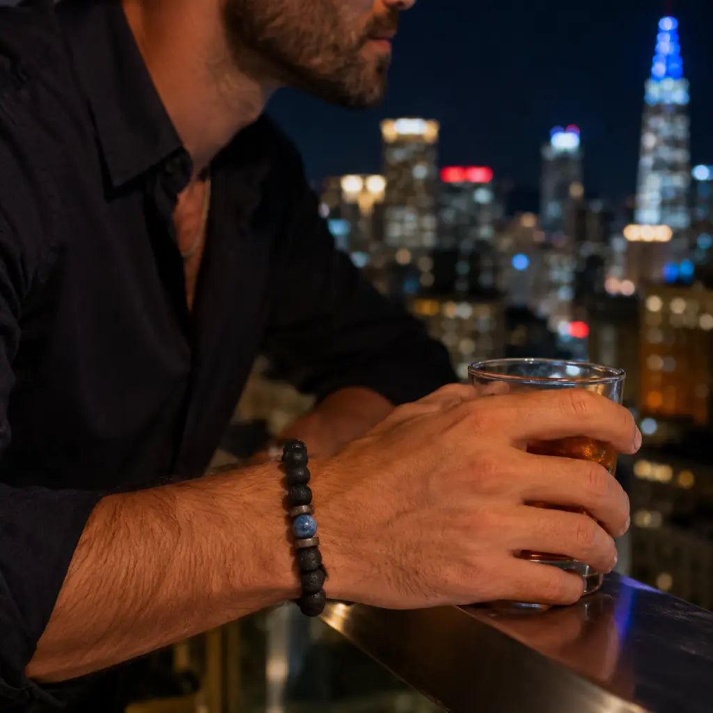 Lava Rock Lapis Lazuli bracelet worn overlooking a city skyline with natural volcanic stone beads and blue lapis centerpiece for modern elegance.