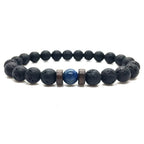 Lava Rock Lapis Lazuli bracelet displaying authentic volcanic lava beads and genuine blue lapis gemstone in a clean product presentation for premium jewelry.