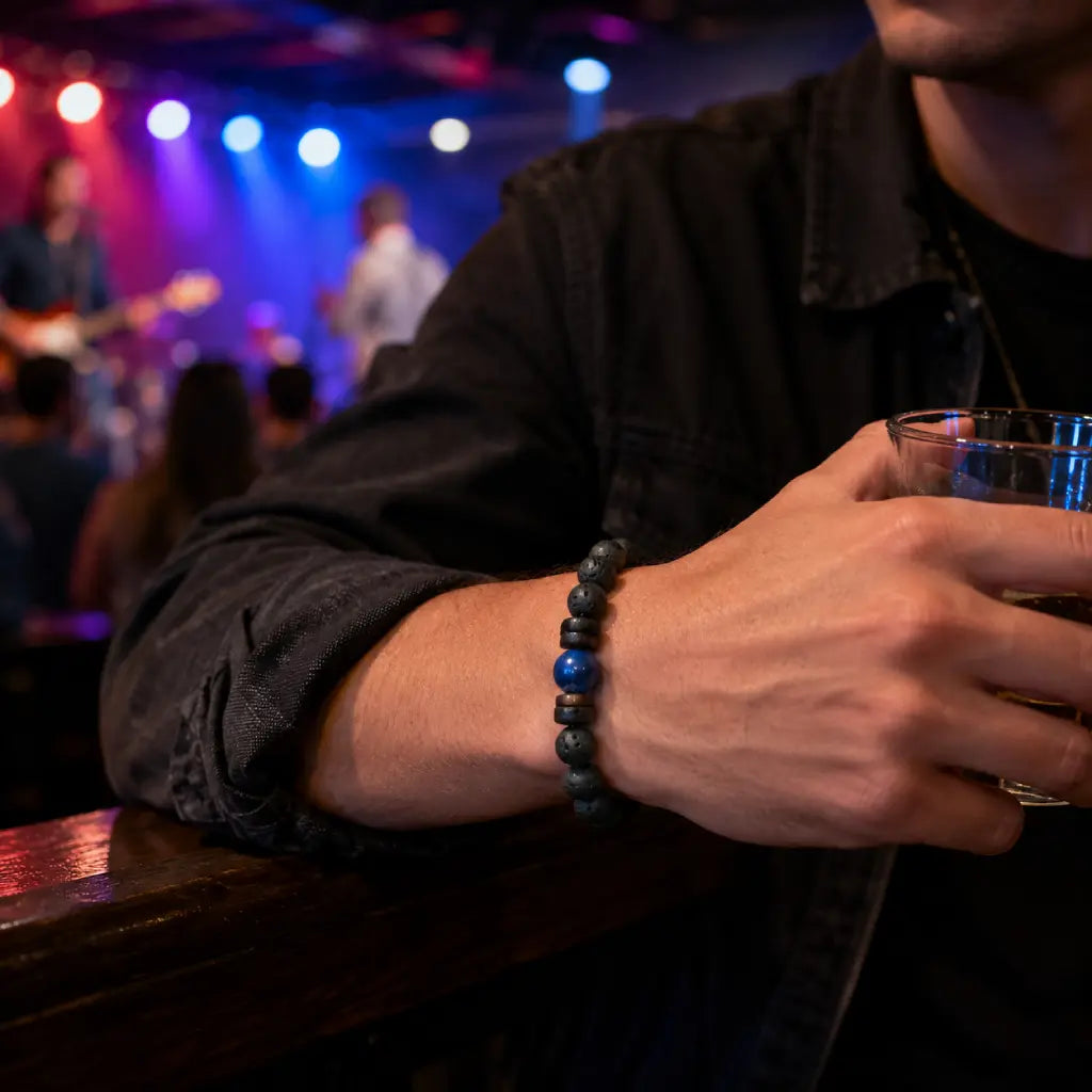 Lava Rock Lapis Lazuli bracelet styled at a live music venue with natural volcanic beads and vivid lapis gemstone for contemporary fashion.