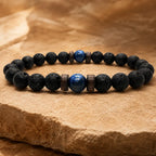 Lava Rock Lapis Lazuli bracelet featuring natural black lava stone beads with a polished blue gemstone centerpiece for stylish everyday wear.