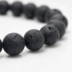Lava Rock Lapis Lazuli bracelet close-up featuring textured volcanic stone beads with handcrafted detailing for premium men's gemstone jewelry.